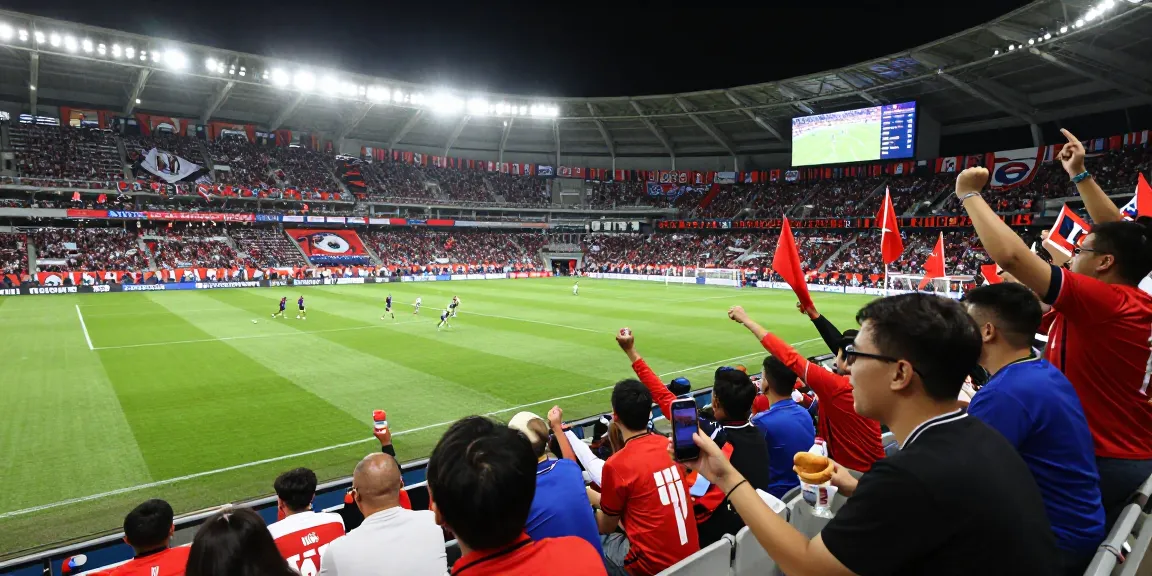 أفضل موقع لمتابعة مباريات اليوم بجودة عالية with enthusiastic fans celebrating live football match in a stadium